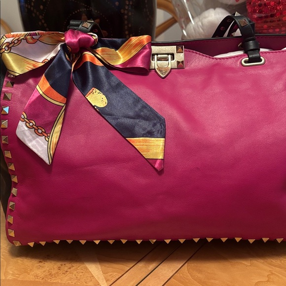 Valentino Garavani Handbags - EUC Valentino Garavani Fuschia/Black Studded $1299